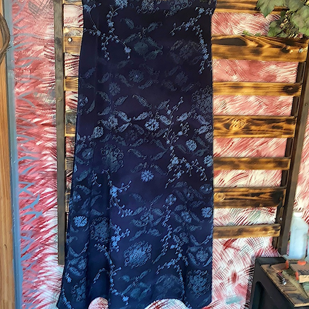 Deep Blue Polyester Skirt. Zips on the side with elastic on back of waist.